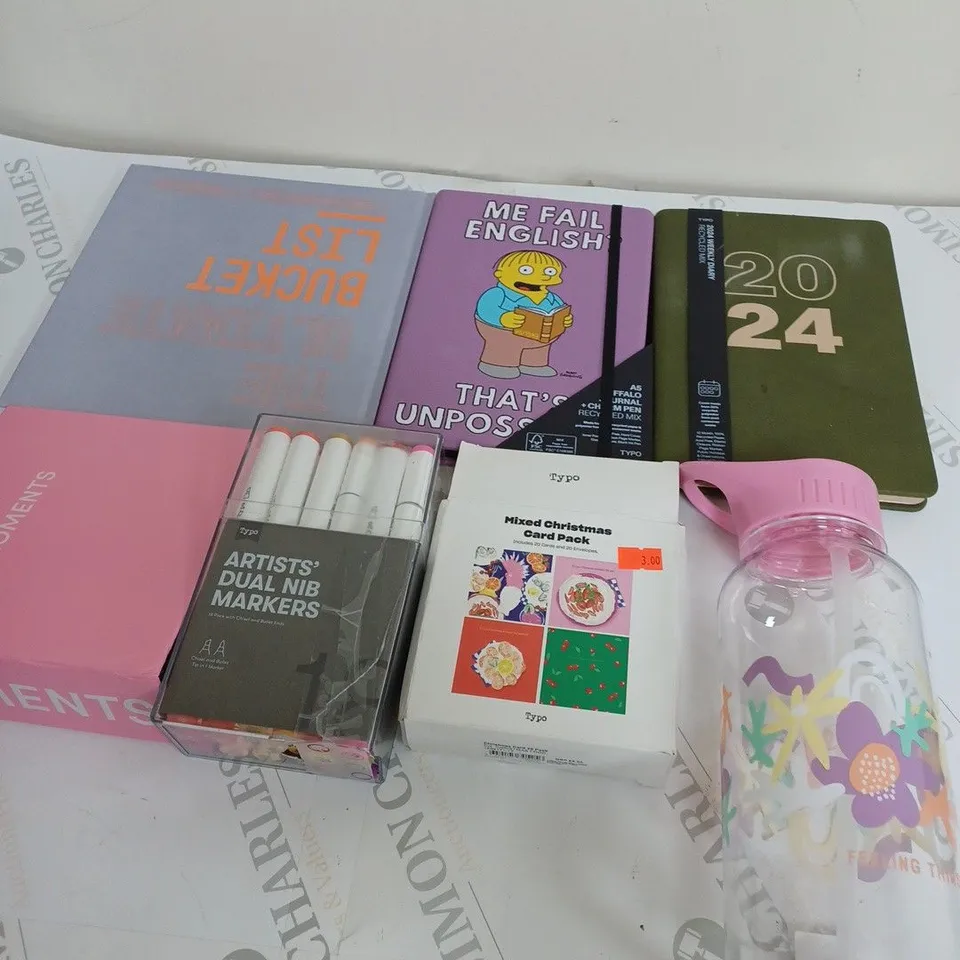 MEDIUM BOX OF ASSORTED HOUSEHOLD ITEMS TOO INCLUDE BOTTLES , DIARY'S AND MARKER PENS