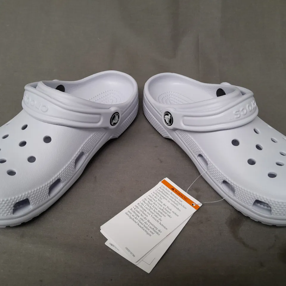 PAIR OF CROCS CLASSICS IN PALE BLUE UK SIZE M3/W4