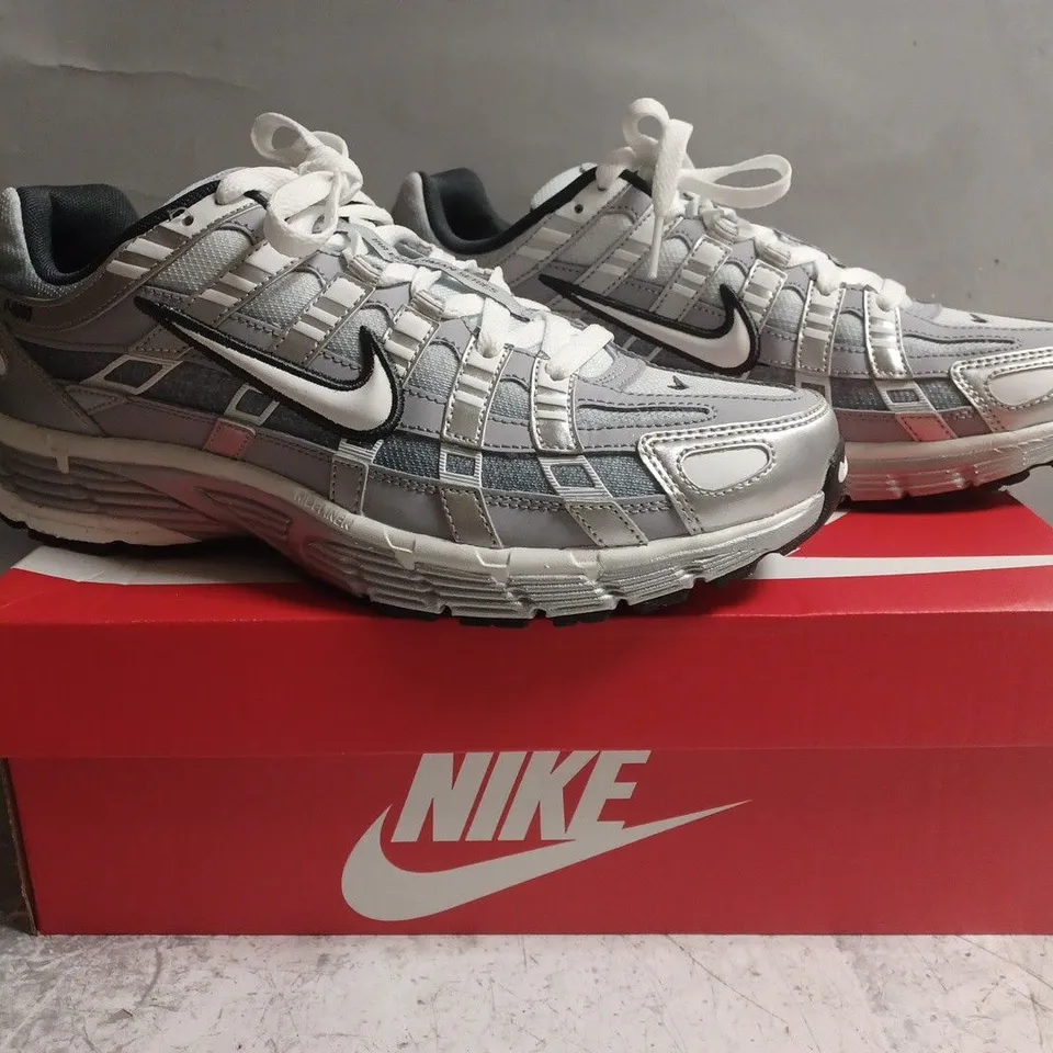 BOXED PAIR OF NIKE P-6000 TRAINERS IN METALLIC SILVER SIZE UK 9
