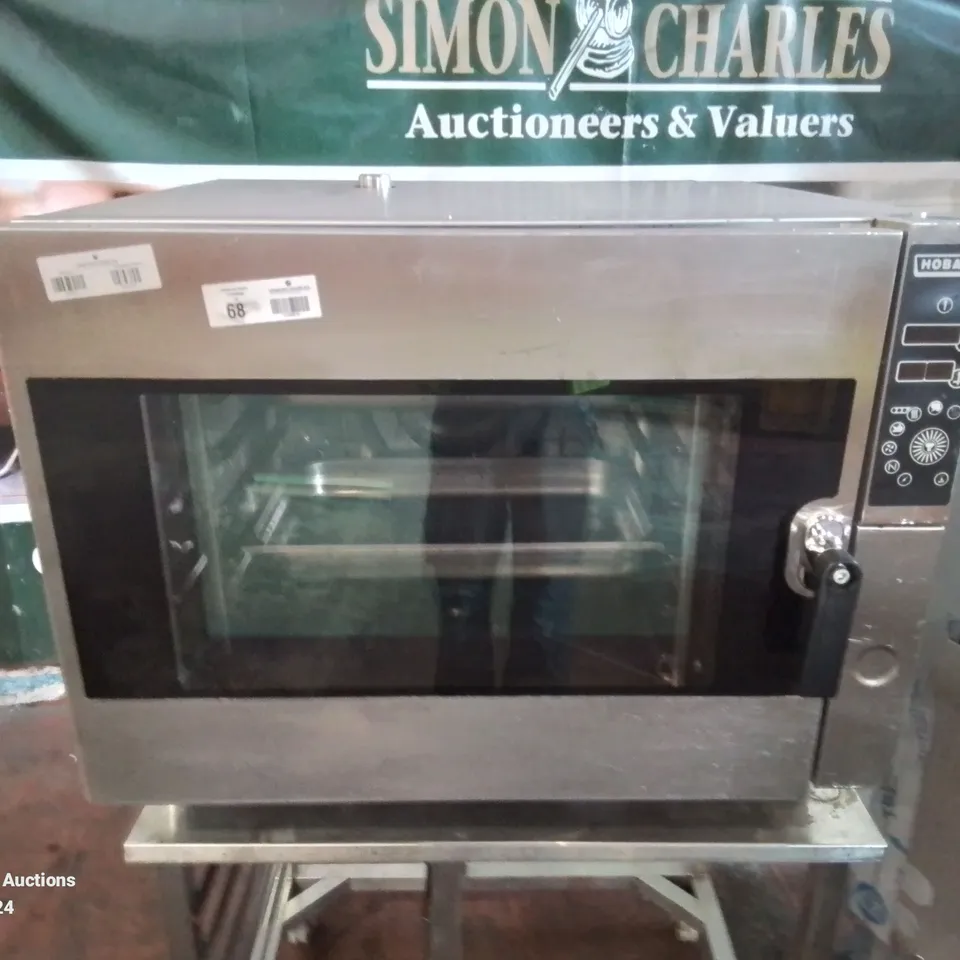 COMMERCIAL STAINLESS STEEL HOBART MULTI RACK STEAMER ON STAINLESS STEEL WORKTOP ON WHEELS