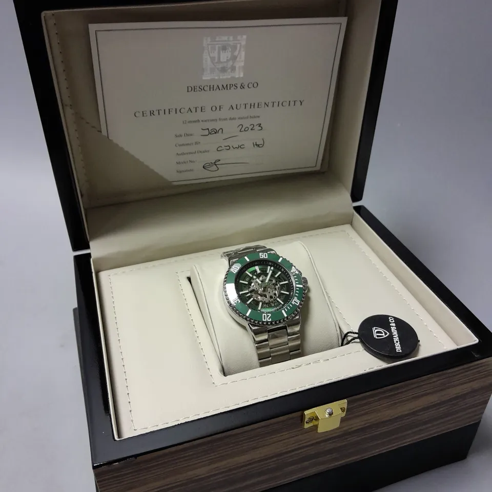 MENS DESCHAMPS & CO SKELETON DIAL STAINLESS STEEL WATCH WITH GREEN FACE IN WOODEN GIFT BOX