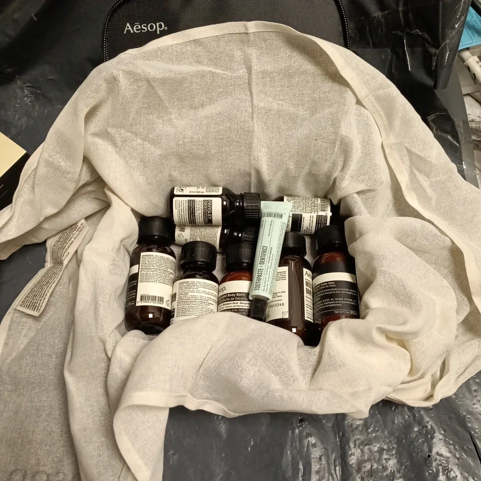 AESOP LONDON TRAVEL KIT INCLUDING TOOTHPASTE, CONDITIONER AND BODY BALM. 9 ITEMS IN TOTAL