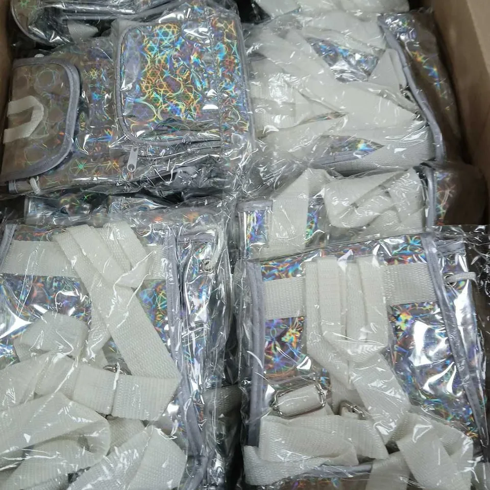 BOX OF APPROX 60 BAGS UNLIMITED HOLOGRAPHIC MINI BACKPACKS IN SILVER