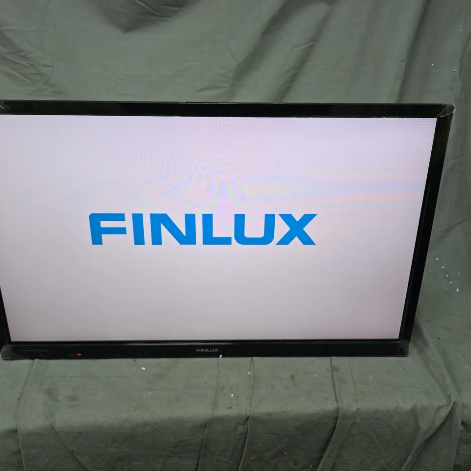 FINLUX FLAT-SCREEN TELEVISION – POWER ON, LOGO DISPLAYED