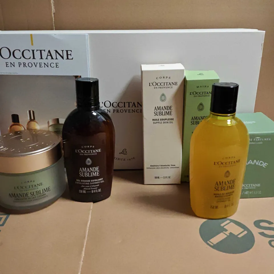 BOXED L'OCCITANE 6-PIECE COSMETICS SET TO INCLUDE SCENTED CANDLE, SMOOTHING MILK CONCENTRATE AND SUPPLE SKN OIL
