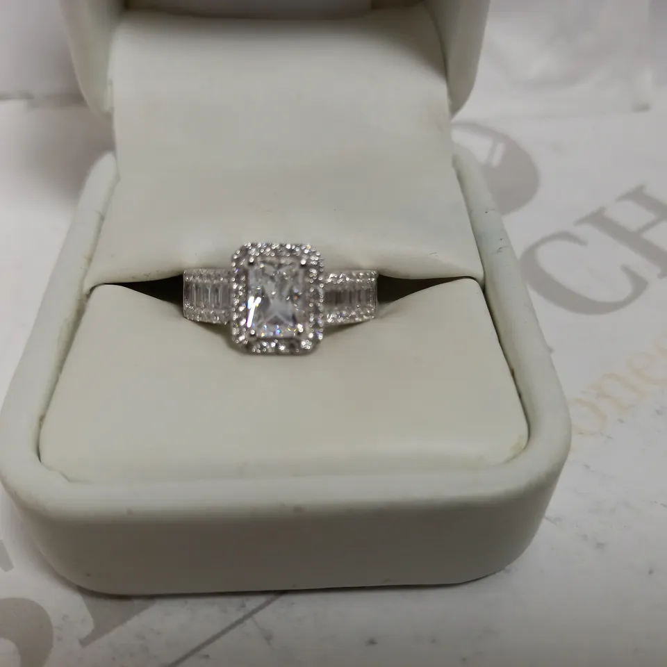 SILVER EMERALD CUT SOLITAIRE RING WITH BAGUETTE CUT SHOULDERS