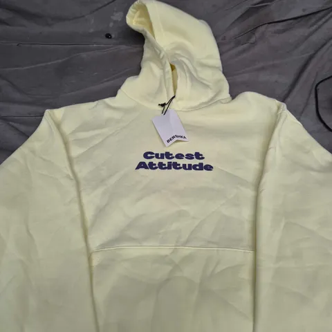 BERSHKA HOODIE – PALE YELLOW WITH 'CUTEST ATTITUDE' SLOGAN SIZE M