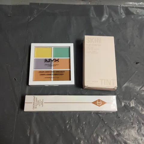 LOT OF 3 ASSORTED COSMETIC PRODUCTS TO INCLUDE - KYLIE SKIN TINT BLURRING ELIXIR IN 1WN - CHARLOTTE TILBURY BEAUTY LIGHT WAND BLUSH IN PINKGASM - NYX COLOUR CORRECTING CONCEALER