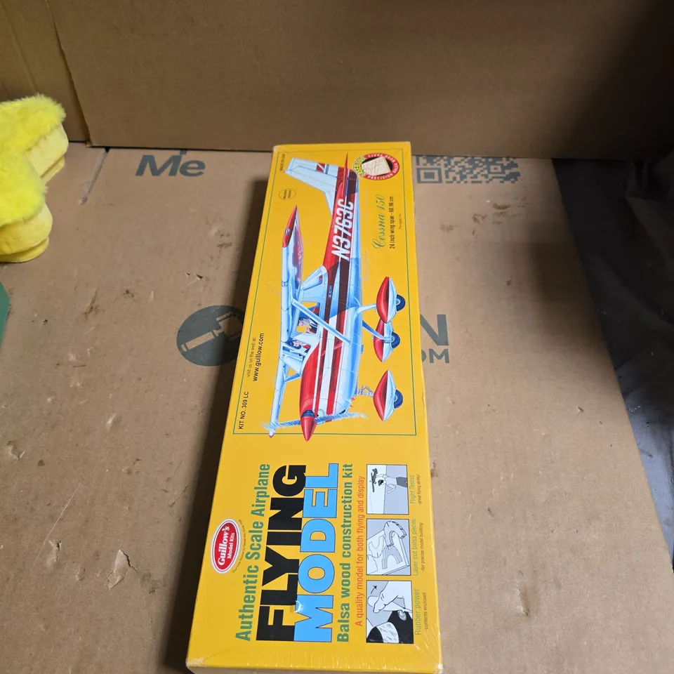 BOX OF APPROXIMATELY 20 ASSORTED TOYS AND GAMES INCLUDING STARFACE CALENDAR , DINOSOSAUR TRAIN AND FLYING MODEL AIRPLANE 