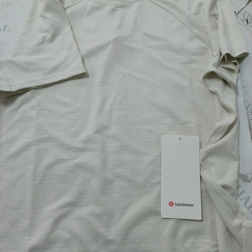 LULULEMON LICENSE TO TRAIN CLASSIC FIT T-SHIRT IN CREAM - SIZE 8