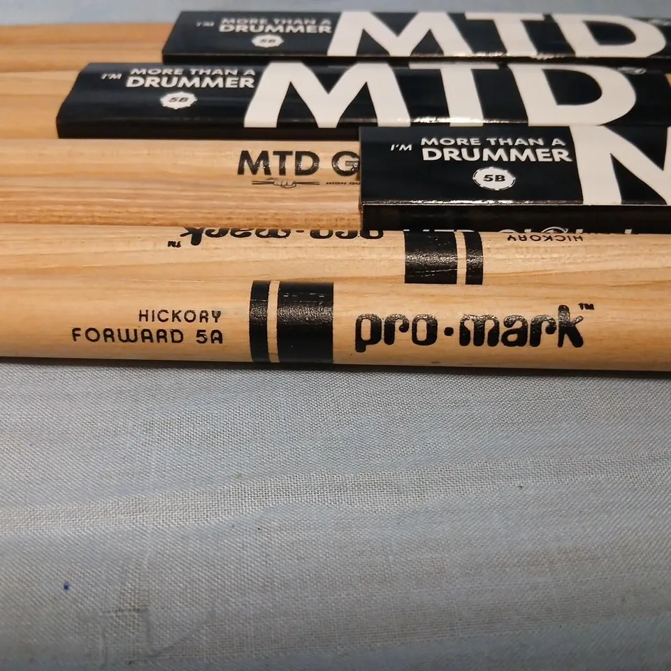 FOUR SETS OF DRUM STICKS TO INCLUDE; PRO-MARK HICKORY FORWARD 5A DRUMSTICKS AND MTD (MORE THAN A DRUMMER) 5B