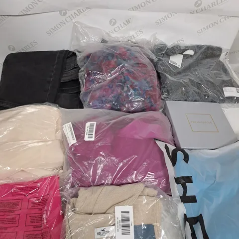 LARGE BOX OF ASSORTED CLOTHING ITEMS IN VARIOUS COLOURS AND SIZES INCLUDING TROUSERS , TOPS AND JUMPERS