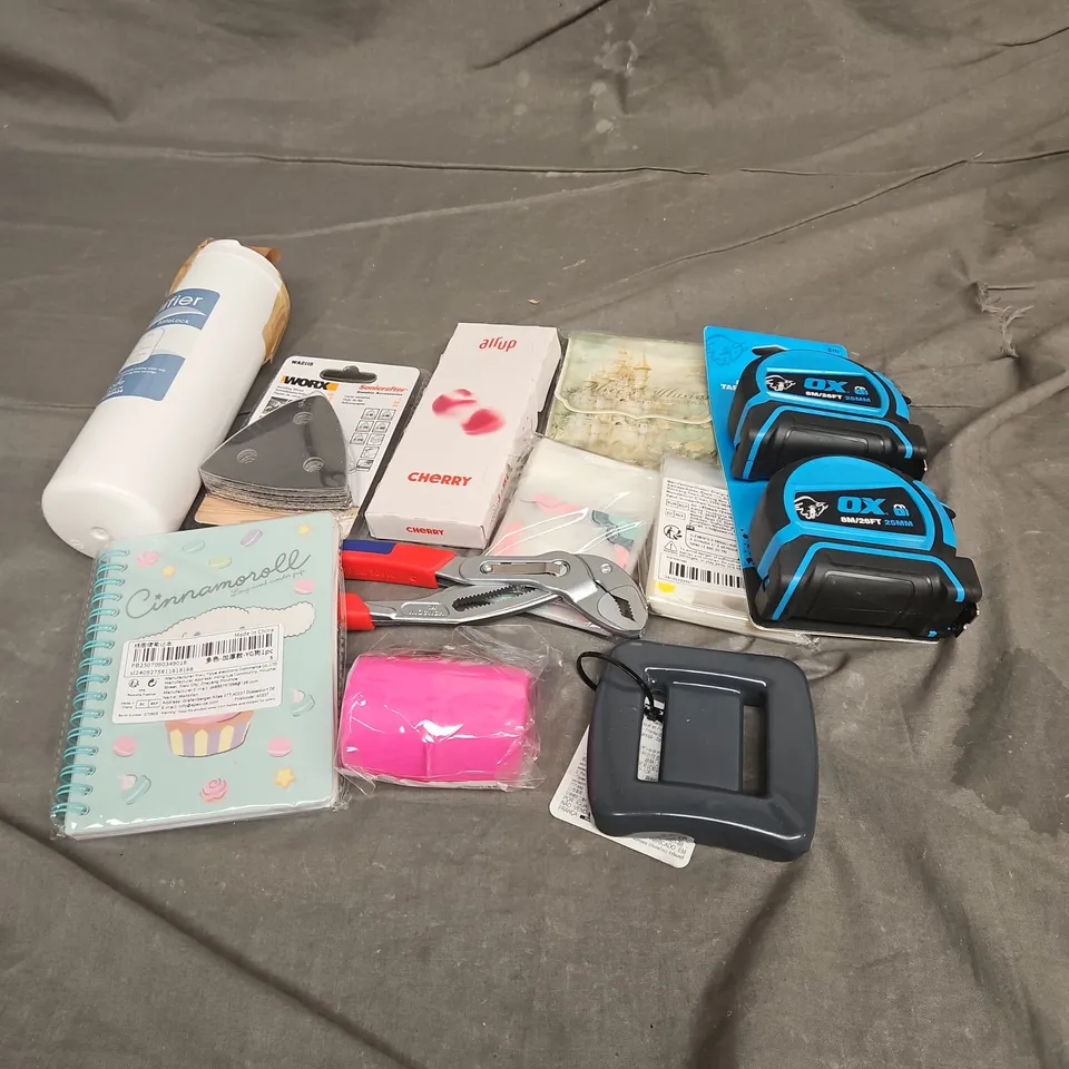 APPROXIMATELY 15 ASSORTED HOUSEHOLD ITEMS TO INCLUDE - OX TAPE MEASURE, CHERRY AIR UP PODS, NOTEBOOK , ETC 