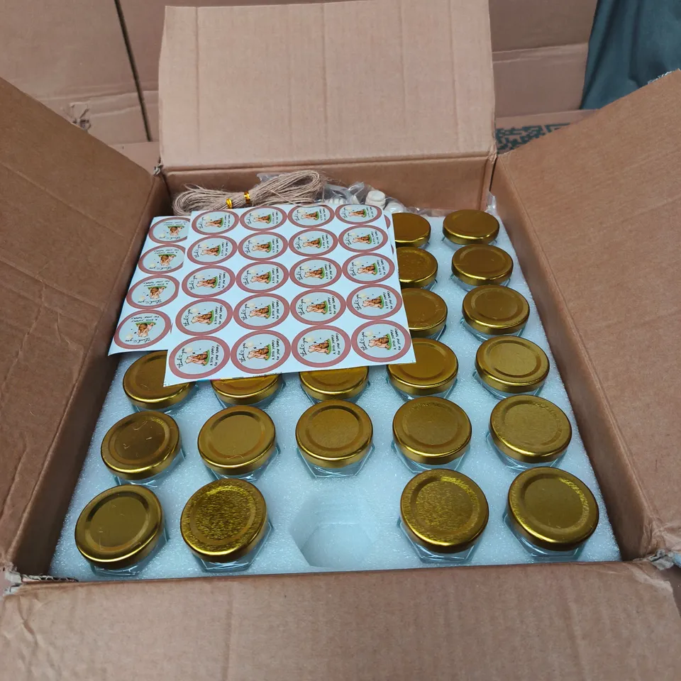 BOX OF APPROXIMATELY 55 MINI HONEY JARS WITH WINNIE THE POOH STICKERS