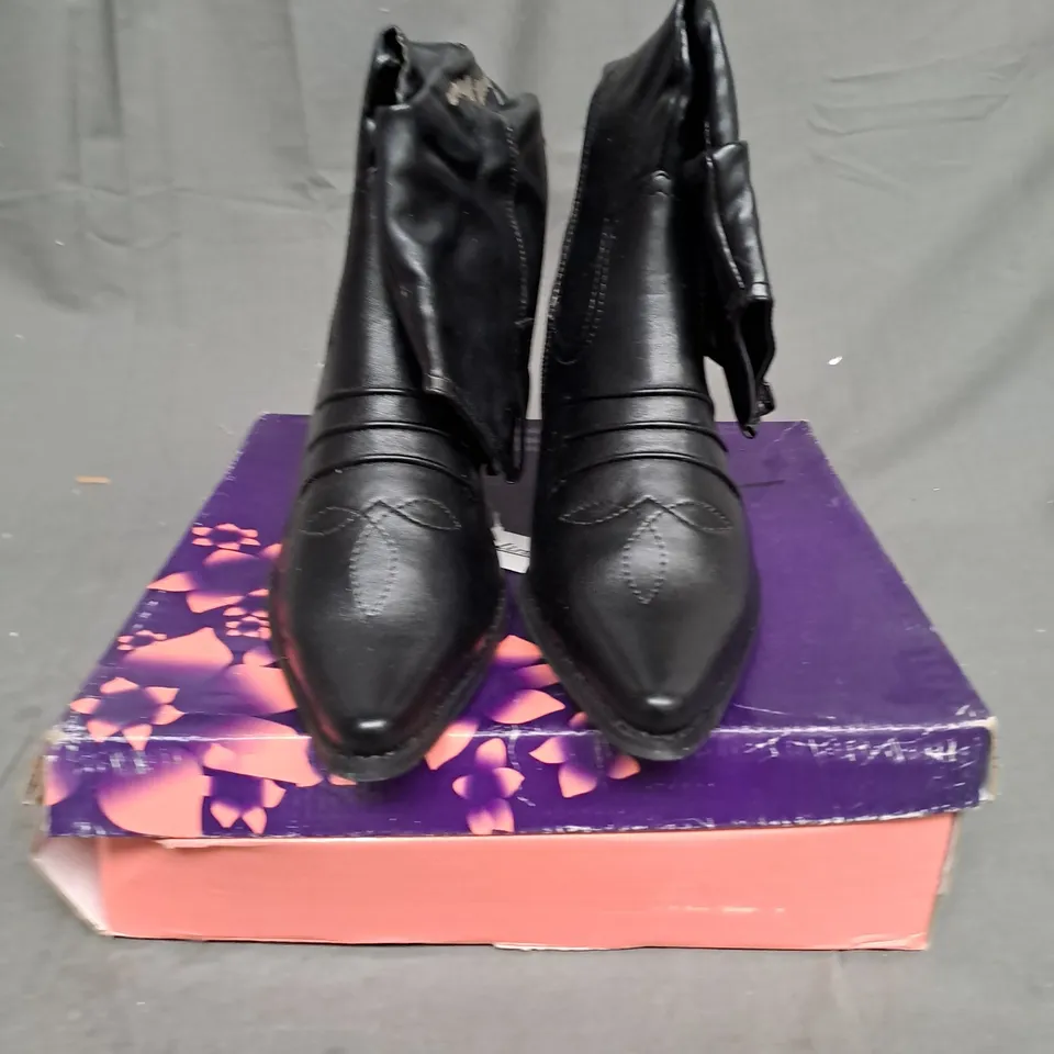BOXED LOT OF 9 PAIRS OF LADIES BLACK BOOTS. VARIOUS SIZES