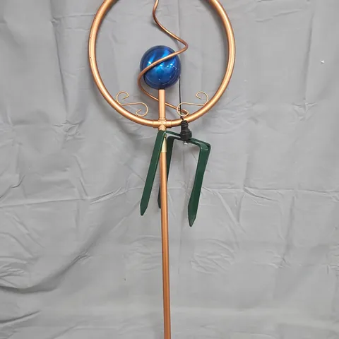 COPPER GARDEN SCULPTURE WITH CIRCULAR RING, BLUE GLASS ORB AND LEAF ACCENTS