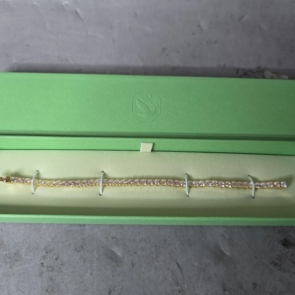SWAROVSKI MATRIX GOLD-TONE PLATED ROUND CUT WHITE TENNIS BRACELET - LARGE