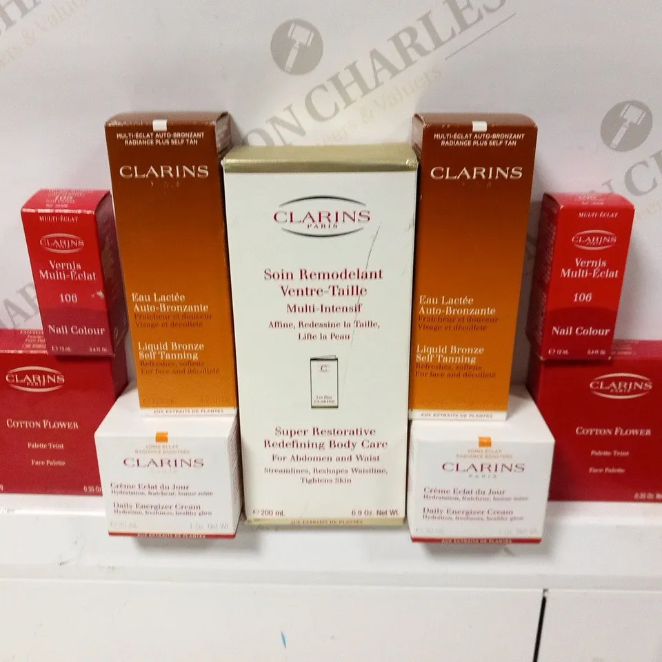 APPROXIMATELY 45 ASSORTED CLARINS PARIS COSMETICS PRODUCTS TO INCLUDE; FACE PALLETTE, NAIL COLOUR, LIQUID BRONZE SELF TANNING, DAILY ENERGIZER CREAM AND  SUPER RESTORATIVE REDEFINING BDY CARE