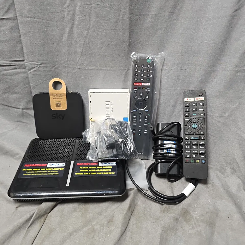 APPROXIMATELY 12 ASSORTED HOUSEHOLD ITEMS TO INCLUDE ROUTERS, TV REMOTES, CABLES, ETC