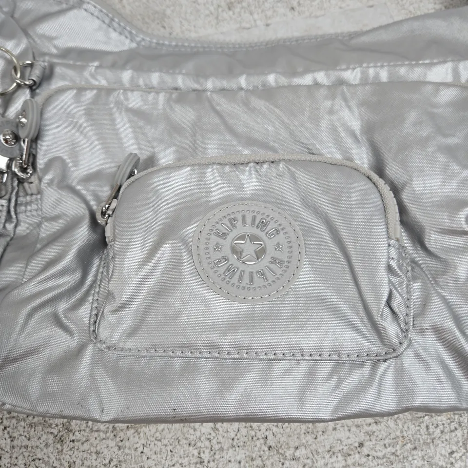 KIPLING CROSSBODY BAG – METALLIC SILVER NYLON WITH FUR POM-POM