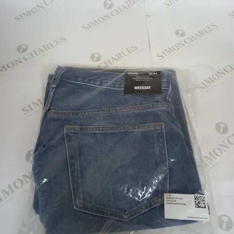 BAGGED WEEKDAY PALE BLUE DENIM JEANS SIZE 32/34