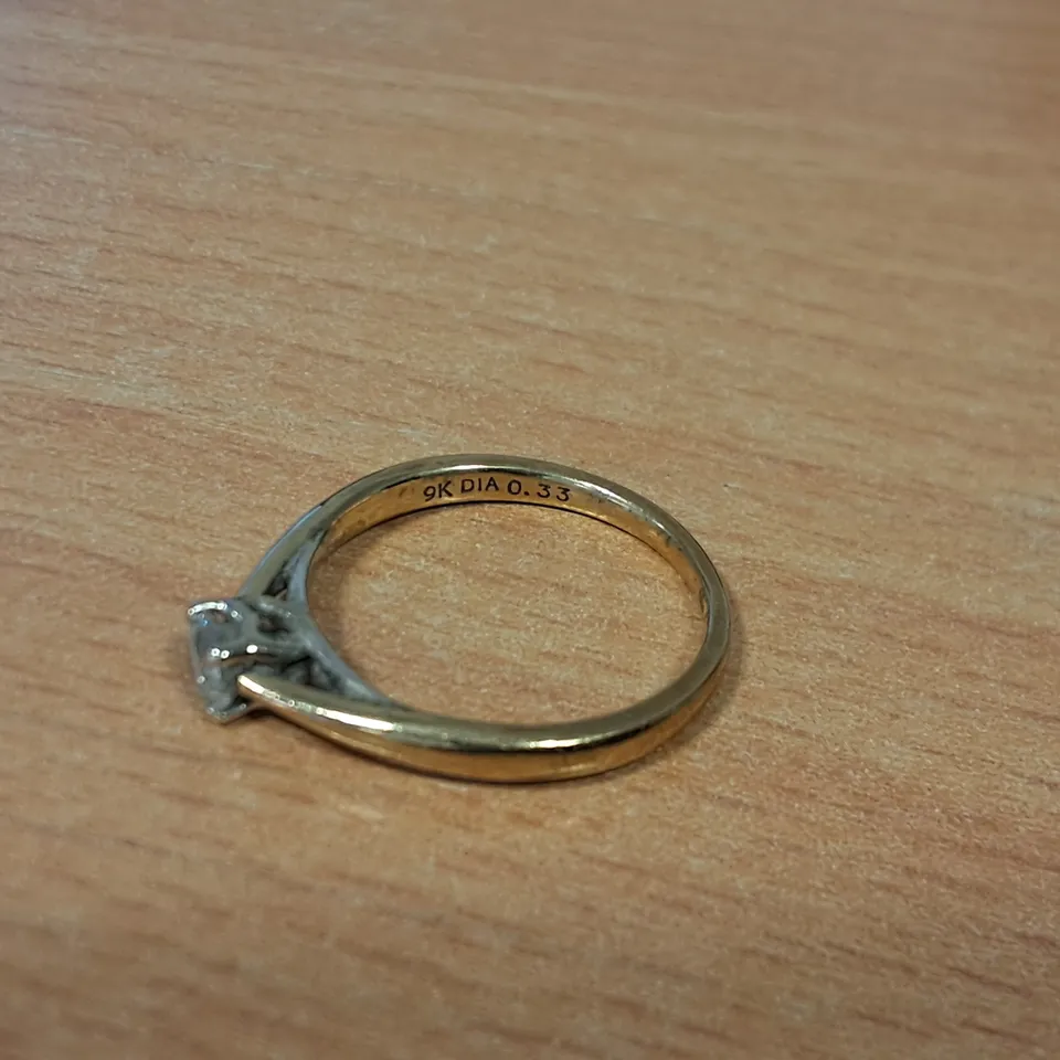 9CT GOLD SOLITAIRE RING SET WITH A NATURAL DIAMOND