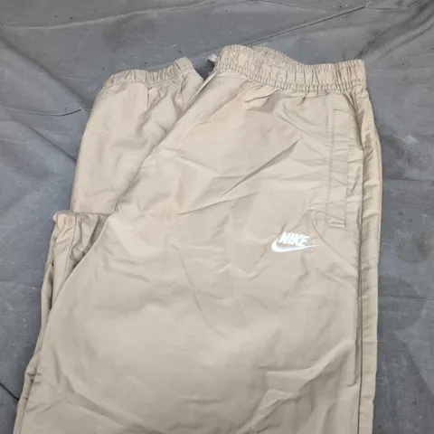 NIKE TAN TRACK PANTS SIZE L