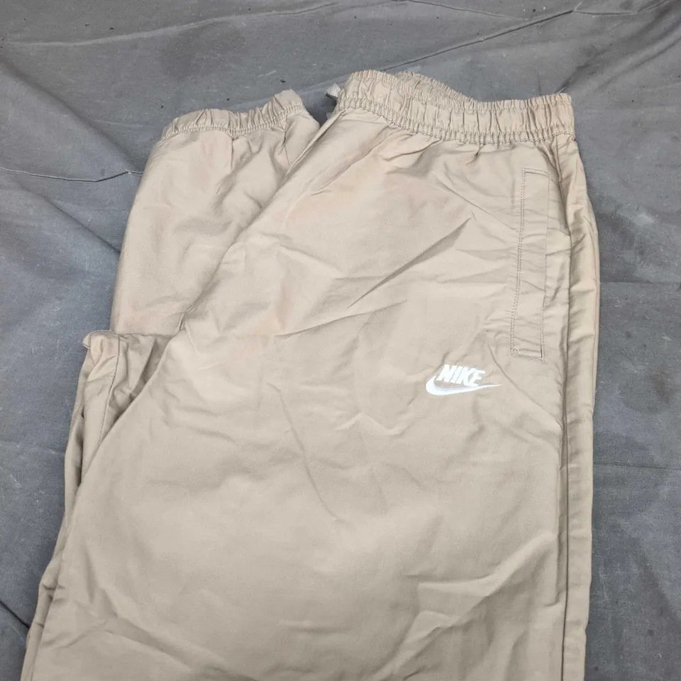 NIKE TAN TRACK PANTS SIZE L