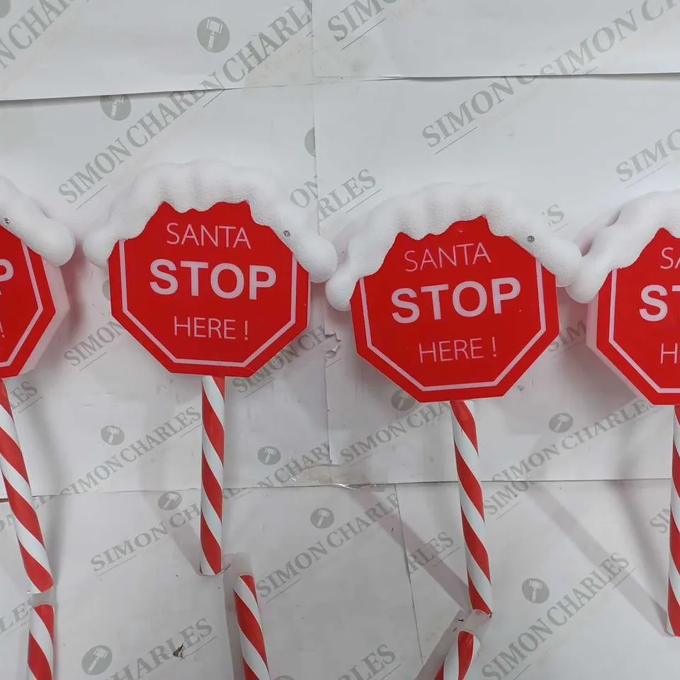 FESTIVE SET OF PRELIT SANTA STOP HERE STAKES