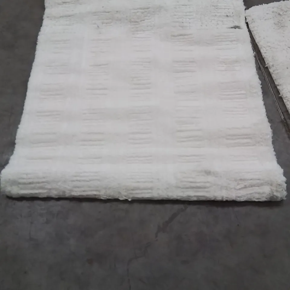 STILLAGE OF APPROXIMATELY 20 BAGGED QUALITY AREA RUGS