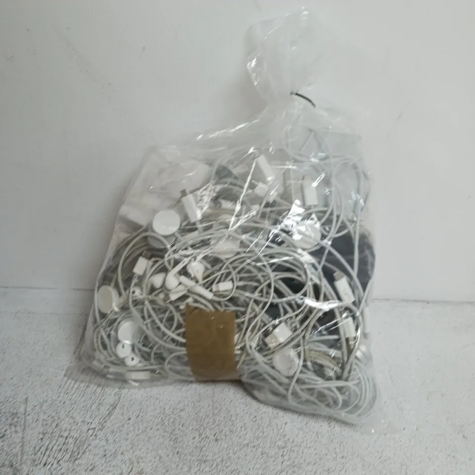 a bag containing a large amount of apple products including earphones, wires, plugs etc.