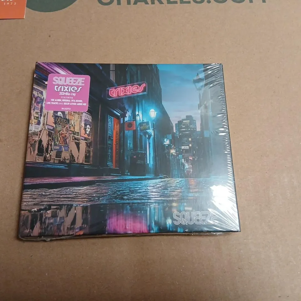 SQUEEZE – TRIXIES ALBUM BUNDLE TO INCLUDE; TRANSPARENT PINK VINYL, 2CD + BLU-RAY, TRIXIES SINGLE ON VINYL, GLEN TILBROOK SIGNED TRIXIES CONCOCTIONS MENU MERCHANDISE