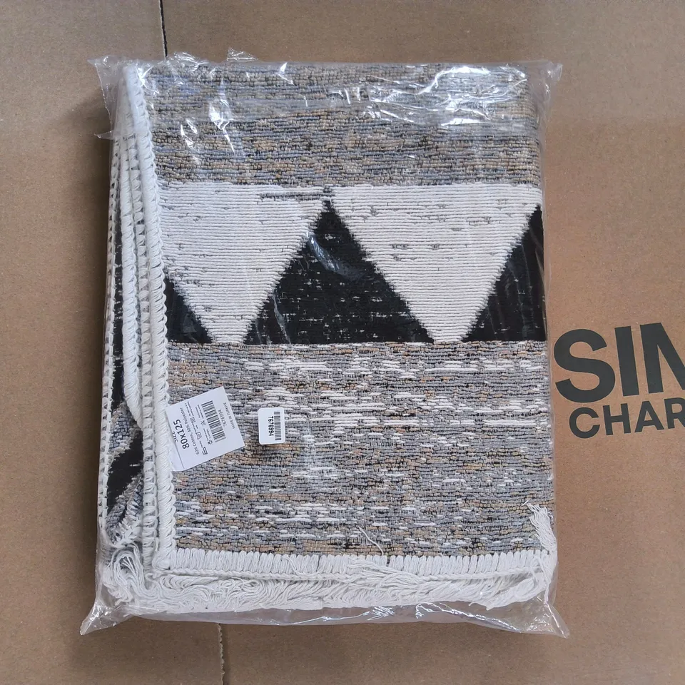 BOX OF APPROXIMATELY 10 SEALED RUGS