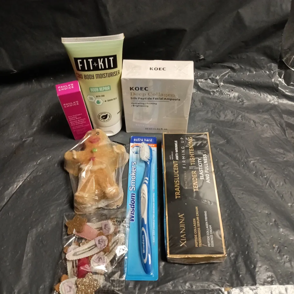 APPROXIMATEY 20 ASSORTED HEALTH AND BEAUTY PRODUCTS TO INCLUDE - GINGERBREAD MAN BATH BOMB - WISDOM SMOKERS TOOTHBRUSH AND PAULA'S CHOICE GLOSS BALM