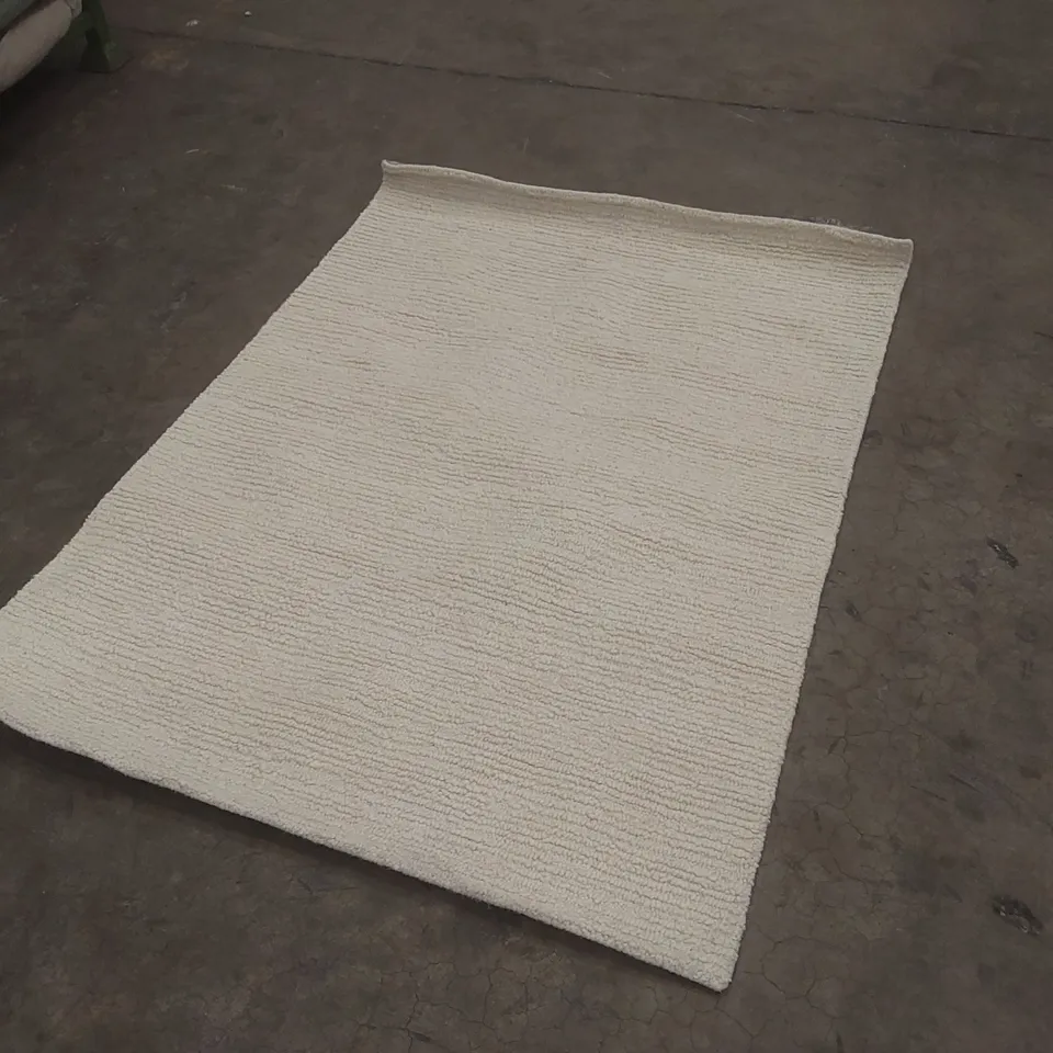 BEIGE WOVEN AREA RUG - APPROXIMATELY 165 X 120CM