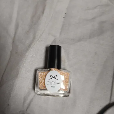BOX OF APPROXIMATELY 70 CIATÉ LONDON MINI NAIL POLISH – GOLD GLITTER-NO EXPIRY DATE SHOWN 