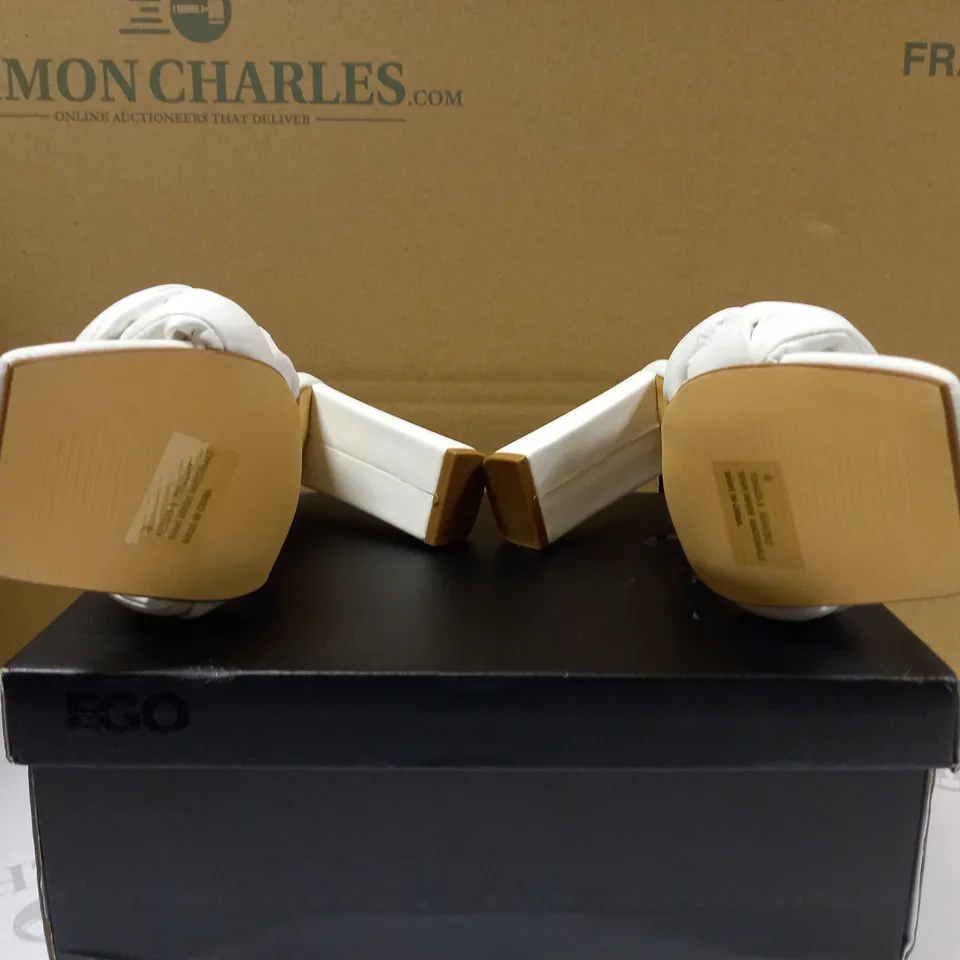 BOXED PAIR OF EGO WHITE WAVELY BLOCK HEEL TWIST SANDALS - SIZE 4