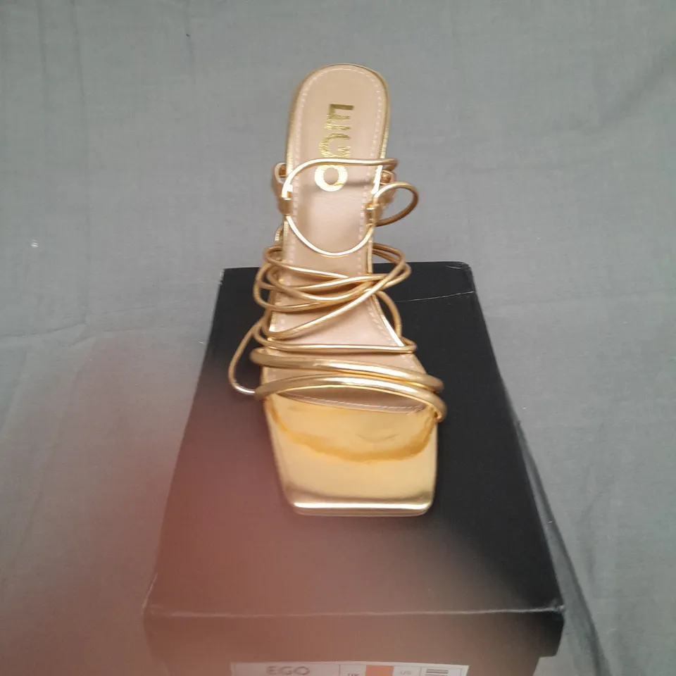 BOXED PAIR OF EGO GOLD HEEL RING TOP SIZE UK 5