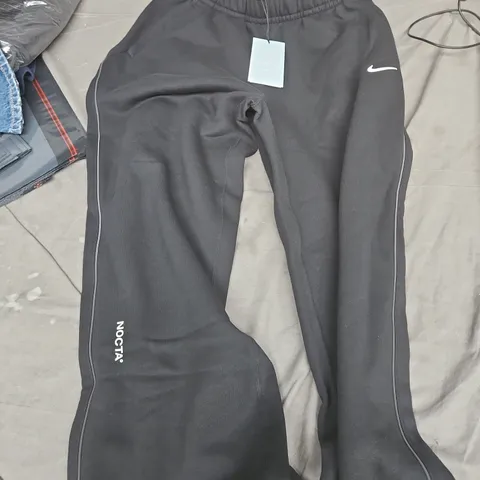 NIKE NOCTA TRACK PANTS – BLACK, SIZE S (MEN)