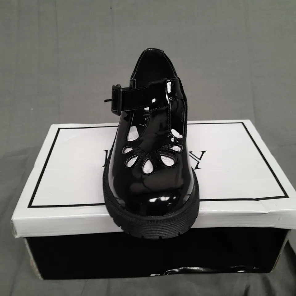 BOXED PAIR OF ENVY SIZE 31 BLACK PATENT BUCKLE TRAINER 