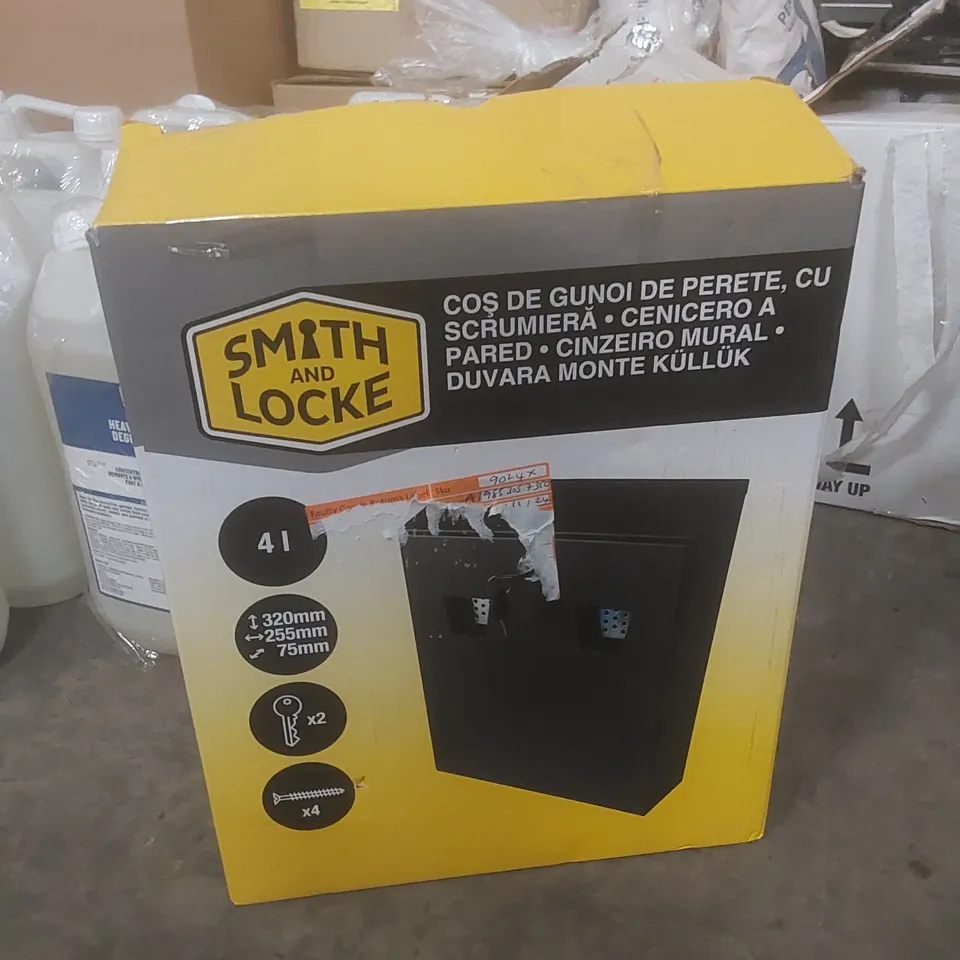 BOXED SMITH AND LOCKE WALL MOUNTED CIGARETTE BIN