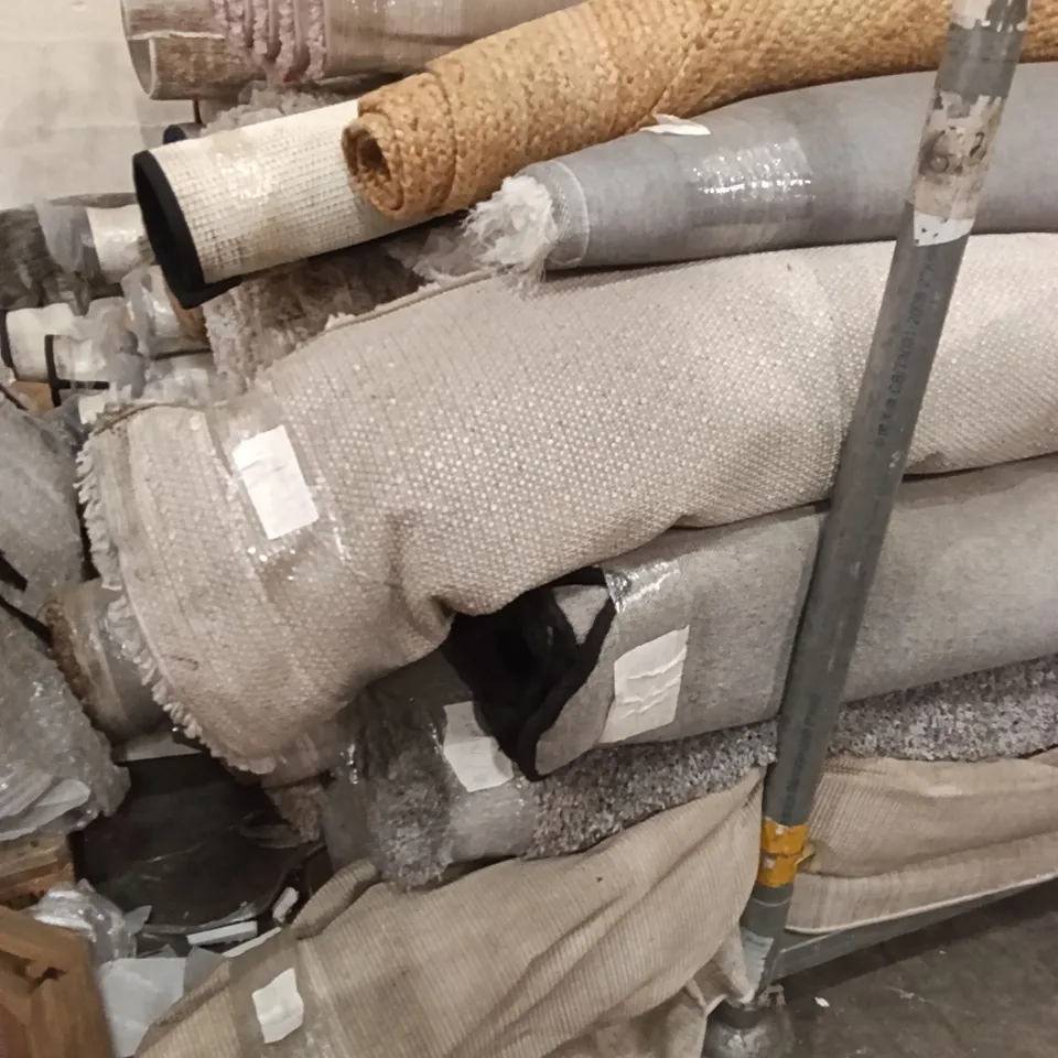 STILLAGE OF DESIGNER RUGS APPROXIMATELY 14 LARGE RUGS
