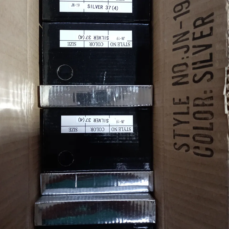 APPROXIMATELY 12 BOXED PAIR OF KELSI SLIVER FAUX PATENT LEATHER SHOES IN VARIOUS SIZES TO INCLUDE SIZE 5 