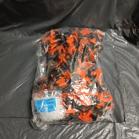 APPROXIMATELY 50 TILE SPACERS – ORANGE