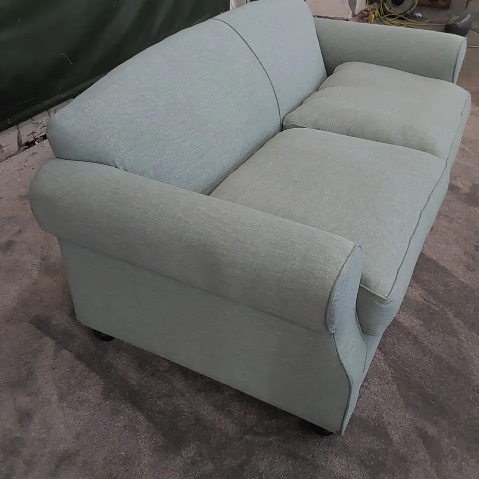 THE CHILMARK 3-SEATER SOFA UPHOLSTERED IN AQUA FABRIC