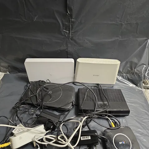 APPROXIMATELY 6 ASSORTED ELECTRICAL PRODUCTS TO INCLUDE - ZYXEL ROUTER - BT ROUTER - SKY ROUTER - ETC 