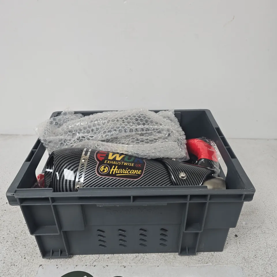 APPROXIMATELY 5 ASSORTED ITEMS INCLUDING ALPHA DRIVE ISIS DRIVE, EW UK EXHAUSTWISE HURRICANE AND A STEERING WHEEL COVER