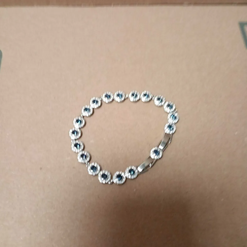 BOXED SWAROVSKI SILVER-TONE BRACELET WITH BLUE STONES IN ROUND BEZEL LINKS