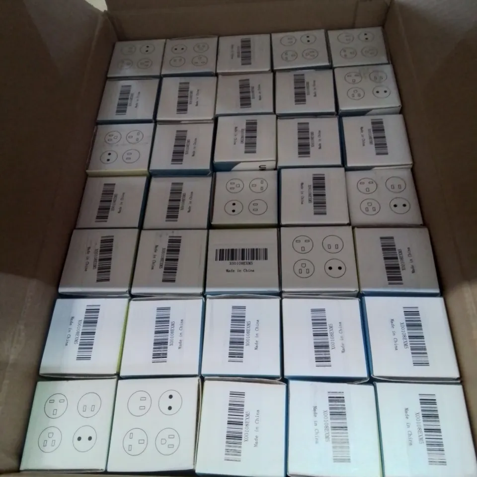 A BOX OF 35 INTERNATIONAL ADAPTER PLUGS 