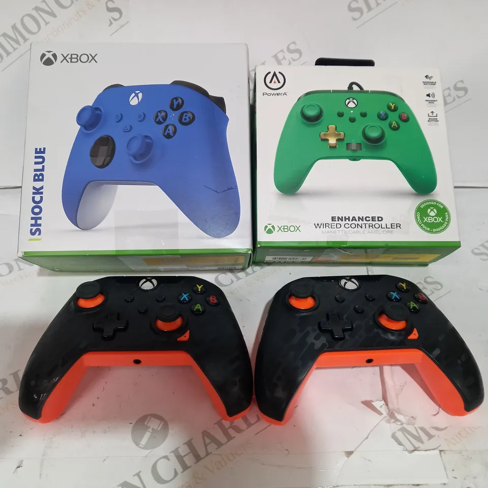 4 XBOX CONTROLLERS INCLUDING BLUE GREEN AND ATOMIC CARBON 